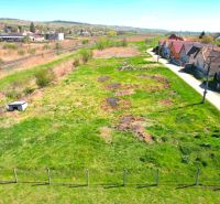 A plot for residential use in Hodejov near the railway track, next to a residential area of family houses.