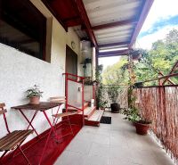 Balcony of a 3-room apartment in Bernolákovo with ceramic tiles and plants.