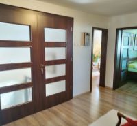 Interior of a family house with solid doors and a wooden decor floor.