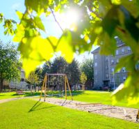 Park with swings and benches on Tabaková in Bratislava - Old Town.
