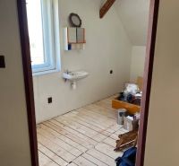 Interior of a family house with two sinks and wooden floor decor.