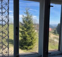 The view from the family house in Korňa with beautiful nature and a clear sky.