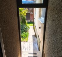 In Zlaté Moravce, the entrance of a family house with a view of the garden.