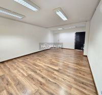 A room space with a wooden decor floor and white walls in a 3-room apartment.