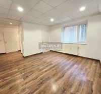 Interior of a 3-room apartment with wood-patterned flooring and white walls.