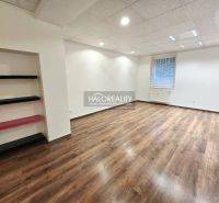 A room with a bright interior and a wooden decor floor in a 3-room apartment.