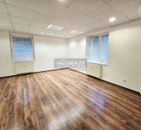 Floor plan of a 3-room apartment with wood-patterned flooring and modern furniture.