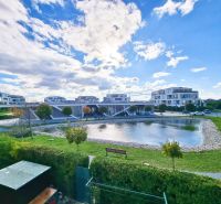 Modern architecture with a water feature and greenery in Malinovo near a 2-room apartment.