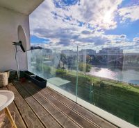 A balcony with a view of the river in Malinovo from a 2-room apartment.