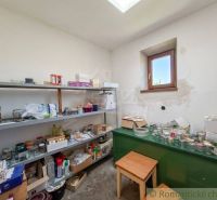 Pantry in a family house with shelves full of food and supplies.