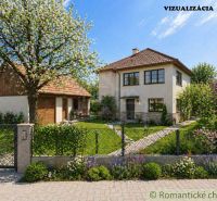 A family house in Kriváň surrounded by a garden with blooming trees and shrubs.