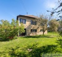 A family house in Kriváň surrounded by greenery and fruit trees in a spacious garden.
