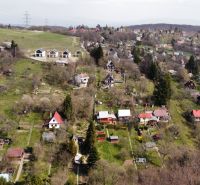 A view of cottages in Košice - Sever district on Kavečianska Road with extensive gardens.