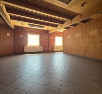 A room in Gastro premises with ceramic tiles and wooden walls and ceiling.