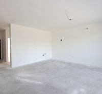 An empty 2-room apartment with white walls and entrance doors.