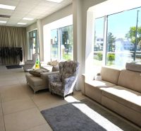 Commercial spaces offering comfortable sofas and armchairs with large windows.