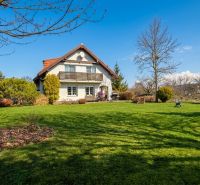 A family house in Sliač with a large garden and a well-maintained lawn.