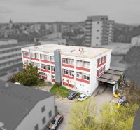 Building on Jána Zigmundíka in Vrbové, business premises with a spacious courtyard and parking.