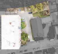 A top-down view of a building and parking lot on Ján Zigmundík Street, Vrbové.