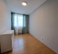 A room in a 3-room apartment with a wooden decor floor and natural light.