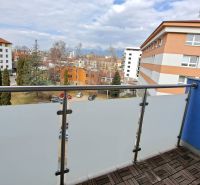 View from the balcony of a 3-room apartment in Poprad with a wooden decor floor.