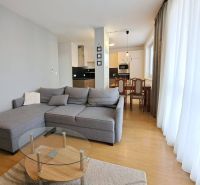 Living room in a 3-room apartment with a corner sofa and a kitchenette.
