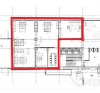 Floor plan of offices with a meeting room and separate workspaces.