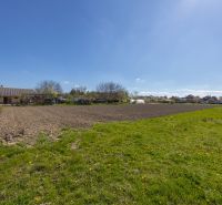 Plots - residential in Dunakiliti with grassy and arable land, surrounded by clear skies.