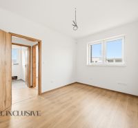 Interior of a family house with a wooden decor floor and white walls.