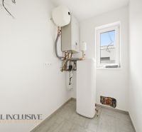 The interior of a family house with technical equipment and tiles on the floor.