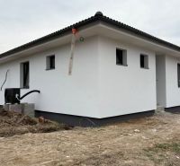 A family house on Hlavná Street in Michalovce with a white facade and a sloped roof.