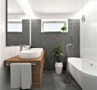 A bathroom in a family house with a bathtub, a sink on a wooden countertop, and a window.
