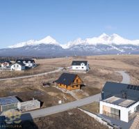 Family houses in Stará Lesná with panoramic views of the snow-capped peaks of the High Tatras.