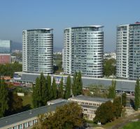 Panorama of Bajkalská in Bratislava with a trio of high-rise buildings and the surroundings of Garages.