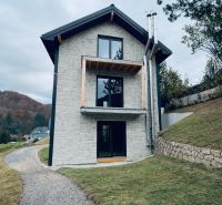 Stone recreational apartment in Mýto pod Ďumbierom surrounded by greenery and nature.