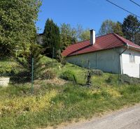 A family house in Čaradice with a garden, surrounded by greenery and nature.