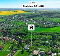 Aerial view of family houses in Čaradice surrounded by green areas and nature.