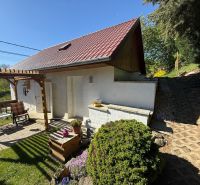 A family house in Čaradice with a terrace, garden seating, and picturesque surroundings.