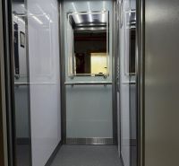 Interior of an elevator with lighting and a mirror, suitable for a 3-room apartment.