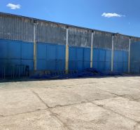 An industrial building with closed blue gates on Košická Street in Rimavská Sobota.