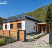 A family house in Šiatorská Bukovinka with wooden cladding and a landscaped garden.