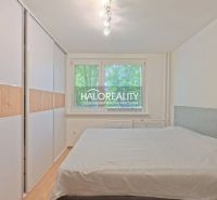 A bedroom with a built-in wardrobe and a double bed in a 2-room apartment.