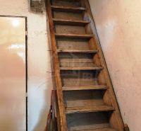 Antique wooden stairs in a family house.