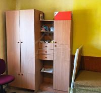 A room with wooden decor furniture in a family house.