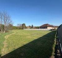 A spacious plot in Pozba suitable for living with a lawn and fencing.
