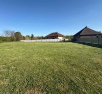 Plots - housing in Pozba offer a spacious grassy area for construction.