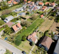 A summer view of residential plots on Nová Street in Viničné.
