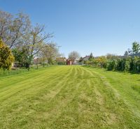 Land on Nová Street in Viničné, designated for residential use, with a manicured lawn.
