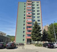 Apartment building in Trenčín on Pred poľom Street, with cars parked next to it.