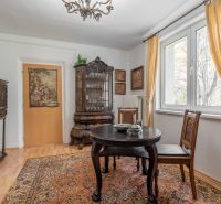 Interior of a 4-room apartment, historical furniture and floor with wooden decor.